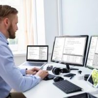 Computer,Programmer,Writing,Program,Code,On,Computer,In,Office Computer,Programmer,Writing,Program,Code,On,Computer,In,Office